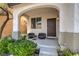 Inviting front porch with seating area and a view of the front door at 10353 Yew Blossom Ave, Las Vegas, NV 89166