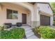 Inviting front porch with comfortable seating and stylish lighting fixtures at 10353 Yew Blossom Ave, Las Vegas, NV 89166
