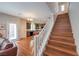 Spacious eat-in kitchen features hardwood floors and stainless steel appliances and leads to the stairs at 10353 Yew Blossom Ave, Las Vegas, NV 89166
