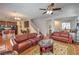 Open concept living area with hardwood floors and seamless flow to kitchen at 10353 Yew Blossom Ave, Las Vegas, NV 89166