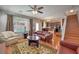 Open concept living area with hardwood floors and seamless flow to kitchen at 10353 Yew Blossom Ave, Las Vegas, NV 89166