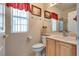 Well-lit bathroom features a vanity with modern fixtures and a glass-enclosed shower at 10361 Profeta Ct, Las Vegas, NV 89135