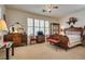 Bedroom features a carved wood bed frame and matching furnishings at 10361 Profeta Ct, Las Vegas, NV 89135