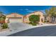 Lovely single-story home featuring desert landscaping and an attached two-car garage at 10361 Profeta Ct, Las Vegas, NV 89135