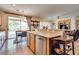 Spacious kitchen features stainless steel appliances, wooden cabinets, and backyard views at 10361 Profeta Ct, Las Vegas, NV 89135