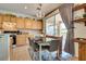 Kitchen dining area features light wood cabinets, stainless steel appliances, and backyard access at 10361 Profeta Ct, Las Vegas, NV 89135