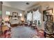 Formal living room with elegant furnishings, ornate decor, and natural light at 10361 Profeta Ct, Las Vegas, NV 89135