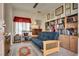 Cozy office space with built-in bookcases and a comfortable futon at 10361 Profeta Ct, Las Vegas, NV 89135