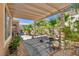 Charming covered patio with a pergola, ideal for outdoor dining and relaxation at 10361 Profeta Ct, Las Vegas, NV 89135