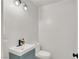 Stylish powder room with modern vanity, sleek fixtures, and ample lighting at 10554 Lilac Tree Ave, Las Vegas, NV 89135