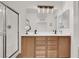 Modern bathroom featuring a double sink vanity and large walk-in shower at 10554 Lilac Tree Ave, Las Vegas, NV 89135