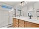 Modern bathroom with double sink vanity and walk-in shower, a luxurious retreat at 10554 Lilac Tree Ave, Las Vegas, NV 89135