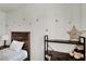 Close-up of a charming bedroom featuring wall decor, and wood shelving at 10554 Lilac Tree Ave, Las Vegas, NV 89135