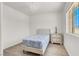 Bedroom boasts wood floors, natural light, a chandelier, and a decorative vase at 10554 Lilac Tree Ave, Las Vegas, NV 89135