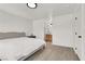 Bright bedroom showcasing a bed and a peek into the bathroom at 10554 Lilac Tree Ave, Las Vegas, NV 89135