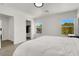Bright bedroom featuring a walk-in closet, with natural light from two windows overlooking the neighborhood at 10554 Lilac Tree Ave, Las Vegas, NV 89135