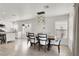 Dining room features light fixtures, wood floors, and is connected to the kitchen for easy serving at 10554 Lilac Tree Ave, Las Vegas, NV 89135