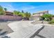 Exterior of a two-story home with a tile roof, a two-car garage, and low-maintenance landscaping at 10554 Lilac Tree Ave, Las Vegas, NV 89135