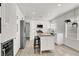 Modern kitchen featuring white cabinets, wood island, and stainless steel appliances at 10554 Lilac Tree Ave, Las Vegas, NV 89135