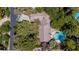 Aerial view of a private residence featuring lush landscaping and a sparkling pool at 108 Quail Run Rd, Henderson, NV 89014