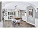 Bright dining room featuring modern lighting, wood floors, and an open floor plan at 108 Quail Run Rd, Henderson, NV 89014