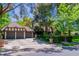 Inviting home with a two-car garage, lush landscaping, and a well-maintained lawn, offering great curb appeal at 108 Quail Run Rd, Henderson, NV 89014