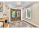 Inviting foyer showcasing ornate double doors, tiled flooring, soft natural light, and decorative accents at 108 Quail Run Rd, Henderson, NV 89014