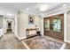 Elegant foyer with dark wood floors, ornate double doors, and stylish decor at 108 Quail Run Rd, Henderson, NV 89014