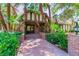 Charming brick home with mature palm trees and manicured landscaping, offering a welcoming and inviting curb appeal at 108 Quail Run Rd, Henderson, NV 89014