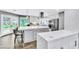 Modern kitchen featuring dual islands, stainless steel appliances, and a garden view at 108 Quail Run Rd, Henderson, NV 89014