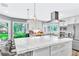 Bright kitchen with marble countertops, stainless steel appliances, and natural light at 108 Quail Run Rd, Henderson, NV 89014