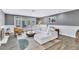 Inviting living room features a fireplace, an oversized white sofa, and glass doors to the patio at 108 Quail Run Rd, Henderson, NV 89014