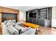 Cozy living room showcasing a fireplace, custom built-ins, and comfortable seating area at 108 Quail Run Rd, Henderson, NV 89014