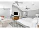 Spacious main bedroom with vaulted ceilings, a seating area, and wood-look floors at 108 Quail Run Rd, Henderson, NV 89014