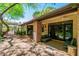 Spacious brick patio features ample seating, ceiling fans and access to the home's interior through elegant glass doors at 108 Quail Run Rd, Henderson, NV 89014