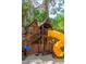 Backyard wooden playhouse with slide and swing set at 108 Quail Run Rd, Henderson, NV 89014