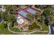 Aerial view of well-maintained tennis courts near clubhouse and landscaped pond area at 108 Quail Run Rd, Henderson, NV 89014