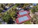 Overhead view of dual tennis courts, complemented by surrounding trees in a residential area at 108 Quail Run Rd, Henderson, NV 89014