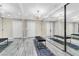 Spacious walk-in closet with full-length mirrors, chandelier lighting, and ample storage space with white wood doors at 108 Quail Run Rd, Henderson, NV 89014