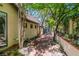 Charming walkway features lush landscaping, a brick path, and decorative stone accents leading to the home at 108 Quail Run Rd, Henderson, NV 89014