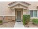 Front entrance with well maintained landscaping and neutral paint at 1150 Red Margin Ct # 101, Las Vegas, NV 89183