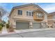 Attractive townhome featuring a private balcony and attached two-car garage at 1150 Red Margin Ct # 101, Las Vegas, NV 89183