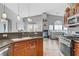 Open-concept kitchen features stainless appliances, stone countertops, and an island sink at 1150 Red Margin Ct # 101, Las Vegas, NV 89183
