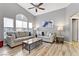 Bright living room with high ceilings, large windows, and comfortable seating at 1150 Red Margin Ct # 101, Las Vegas, NV 89183