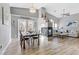 Open concept living room with fireplace, dining area, and lots of natural light at 1150 Red Margin Ct # 101, Las Vegas, NV 89183