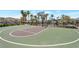 Community basketball court surrounded by palm trees and landscaping at 12348 Golden Wreath Rd # 1, Las Vegas, NV 89183