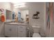 Well-lit bathroom features a granite countertop, a sink and decorated with moose wall art at 12348 Golden Wreath Rd # 1, Las Vegas, NV 89183