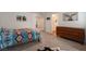Another view of the bedroom showcasing a large dresser and continued stylish decor at 12348 Golden Wreath Rd # 1, Las Vegas, NV 89183