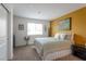 Inviting bedroom with a green patterned bedspread, decorative wall accents, and a window at 12348 Golden Wreath Rd # 1, Las Vegas, NV 89183