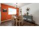 Bright and inviting dining room with a stylish chandelier and rustic decor at 12348 Golden Wreath Rd # 1, Las Vegas, NV 89183